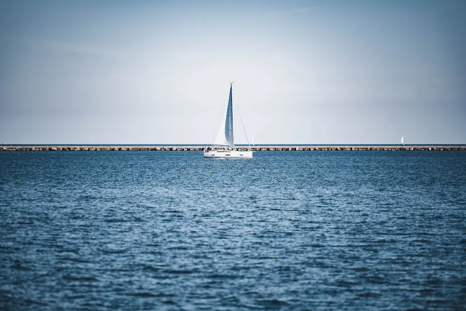 Boats along the calm shoreline of Spring Lake, Michigan